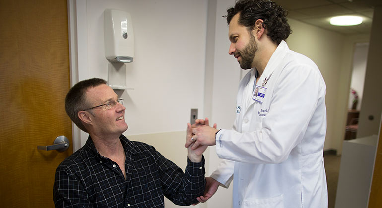 doctor talking with patient